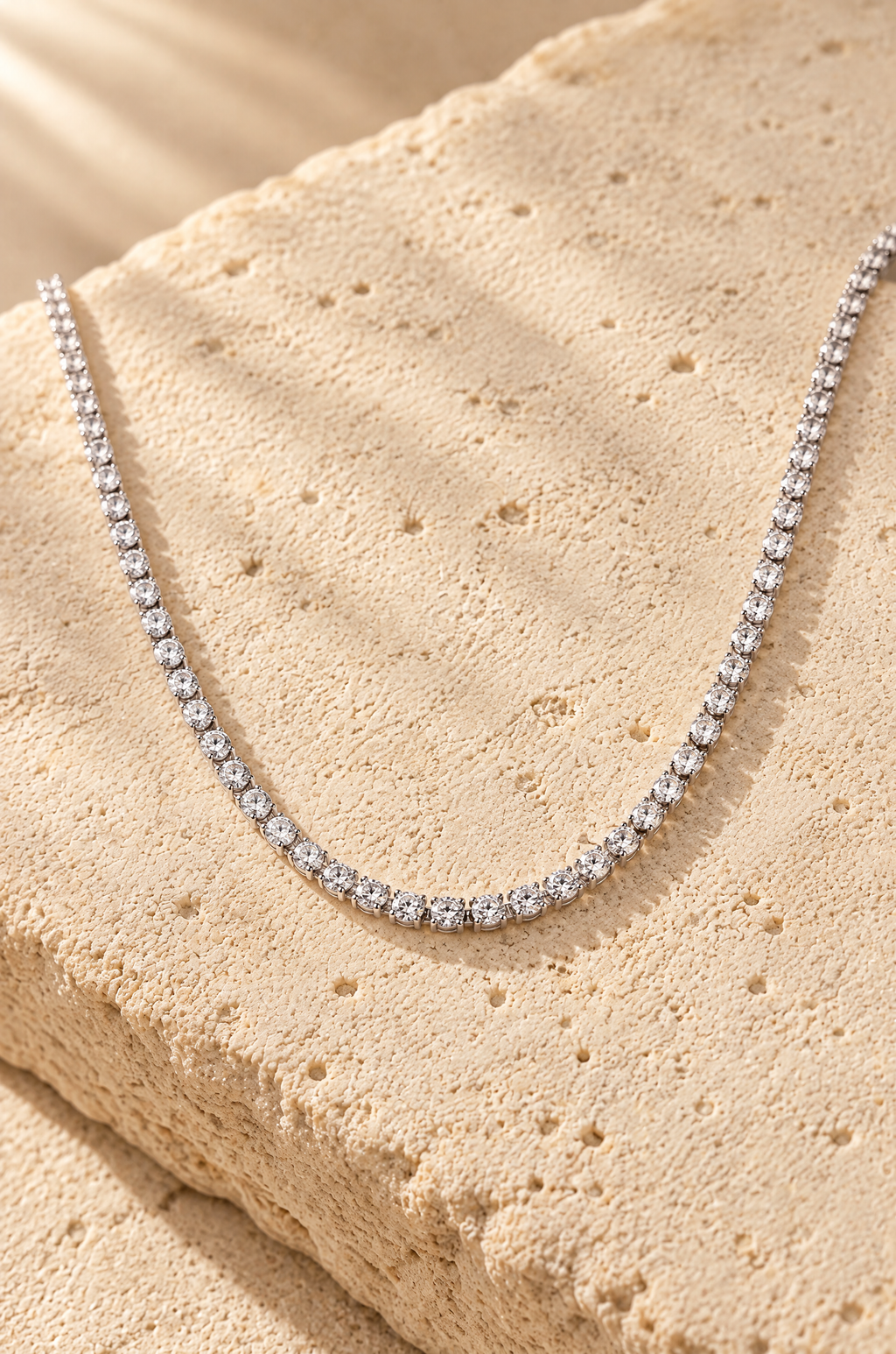 Portofino tennis necklace, on travertine
