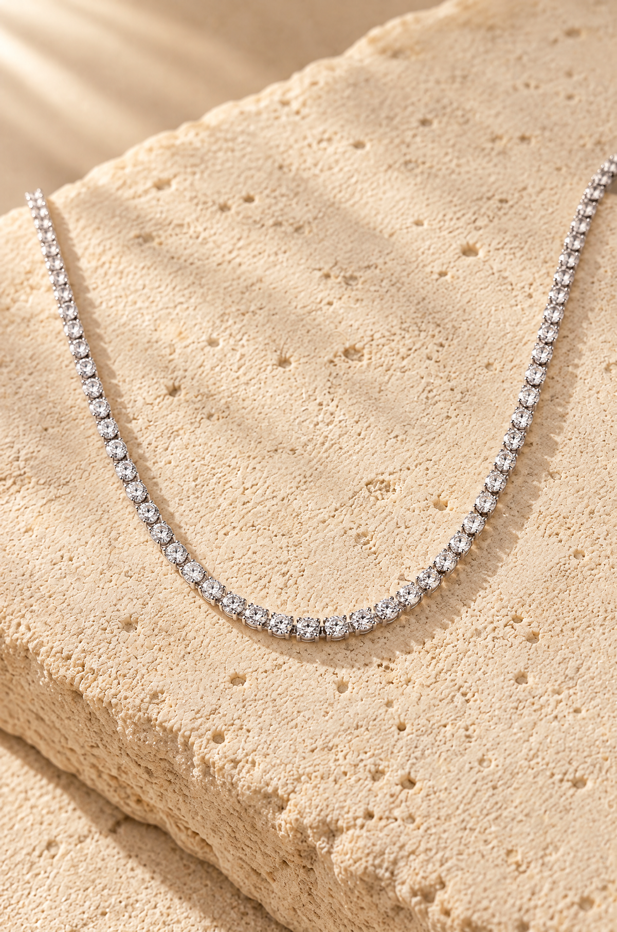 Portofino tennis necklace, on travertine