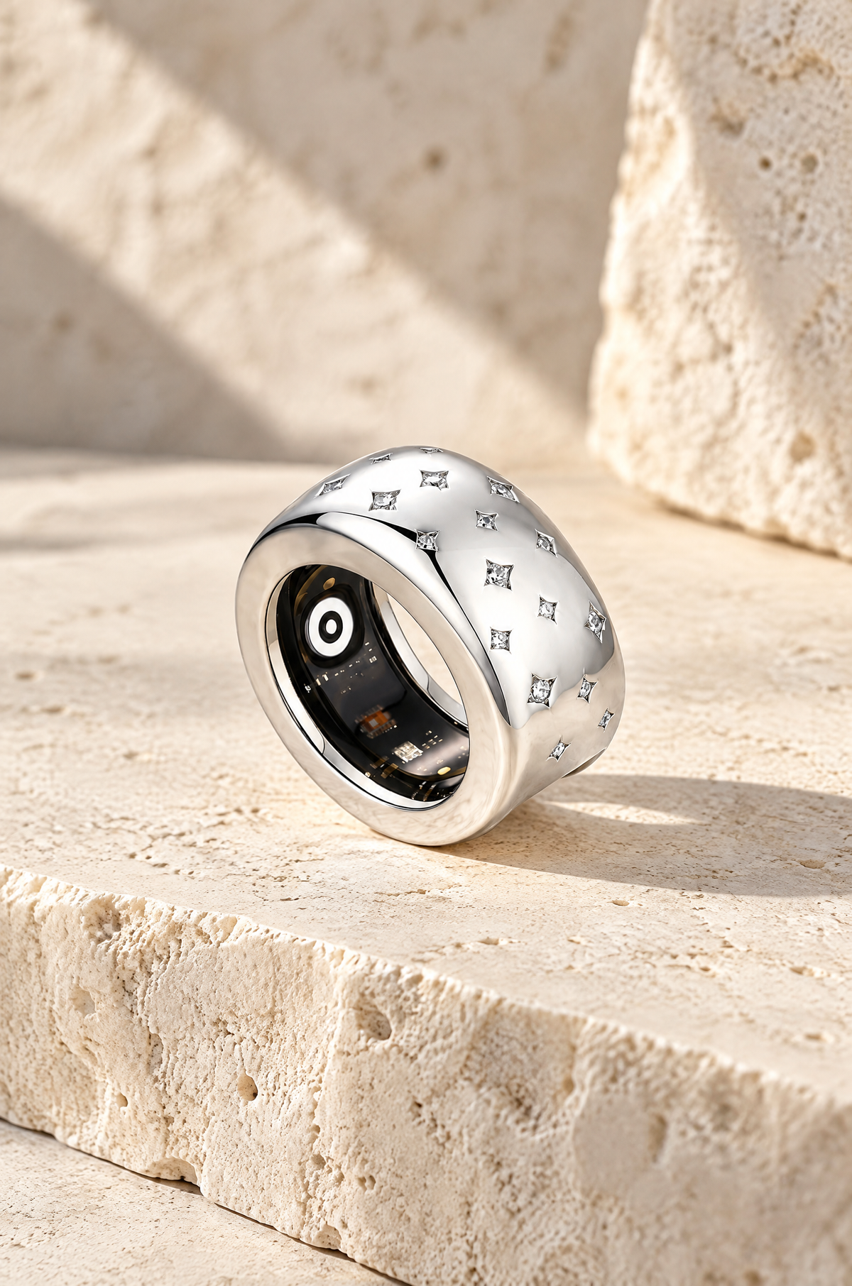 Silver Stromboli starburst ring cover on travertine