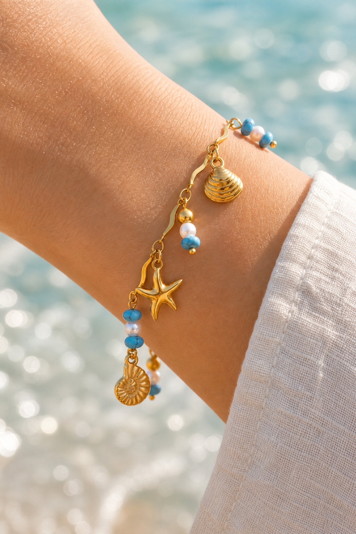 Ocean charm bracelet on the wrist
