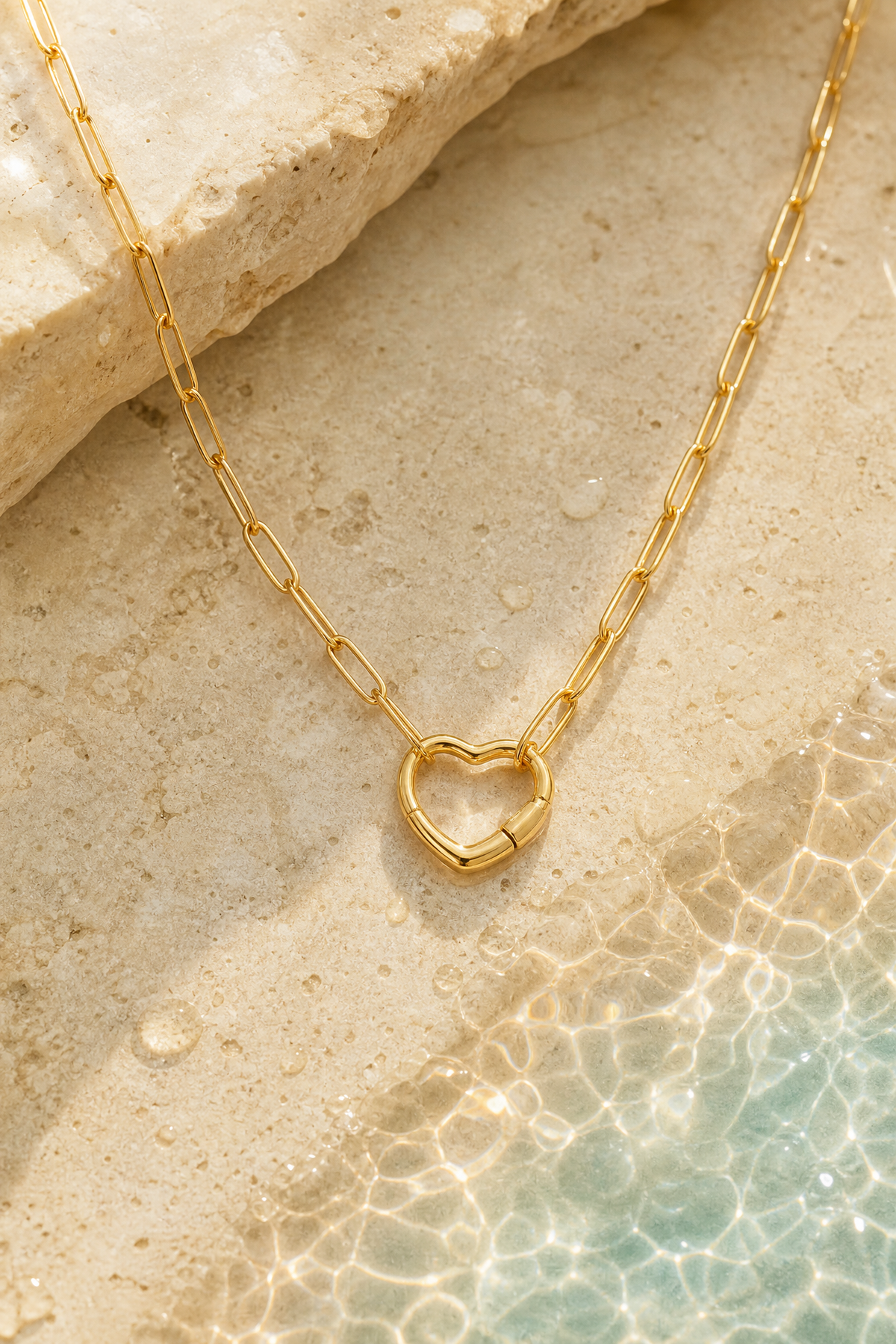 Water on the gold carabiner necklace