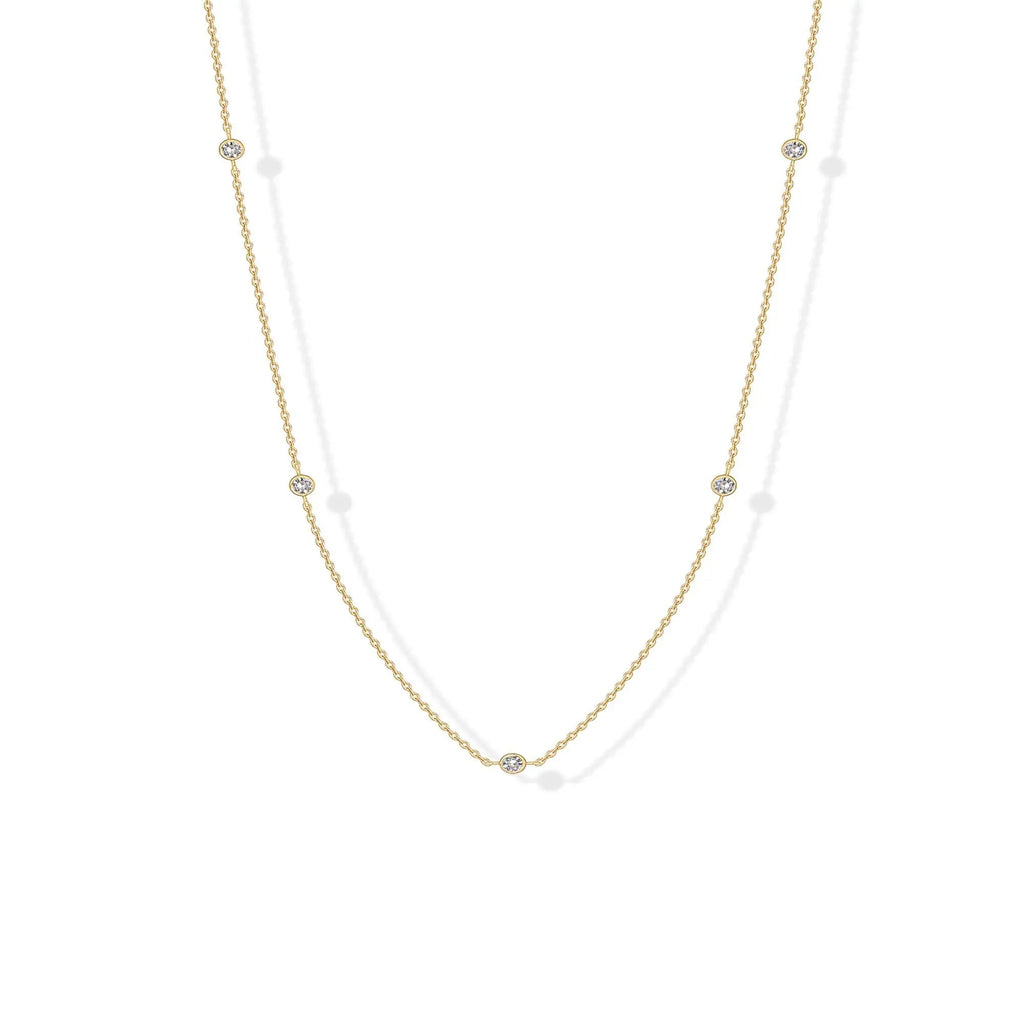 Stellina station necklace in yellow gold, full length on white