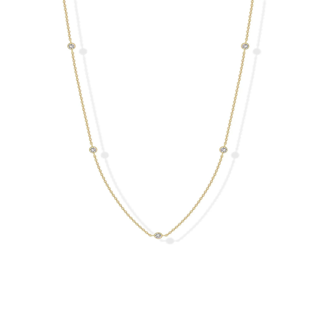 Stellina station necklace in yellow gold, full length on white