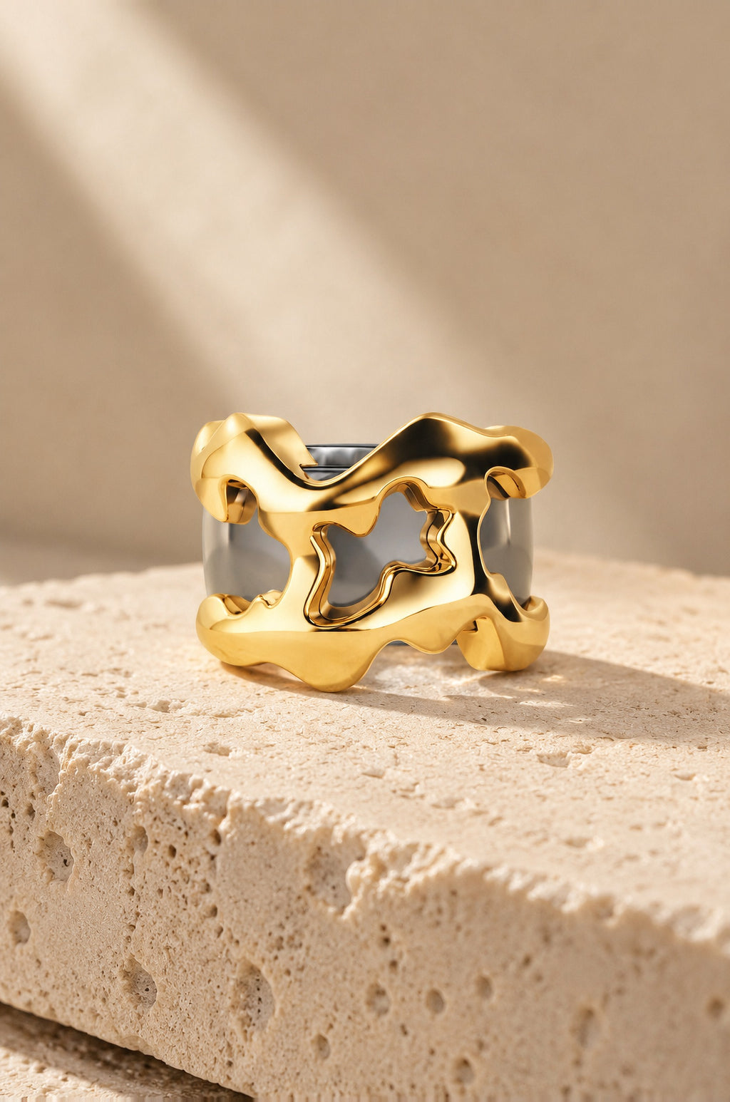 Filicudi ring cover in gold on travertine