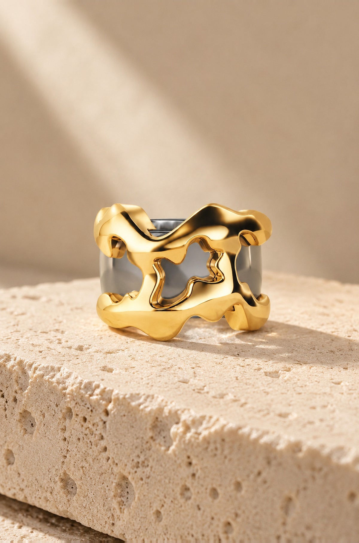 Filicudi ring cover in gold on travertine