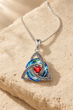 Nodo knot necklace on warm travertine stone