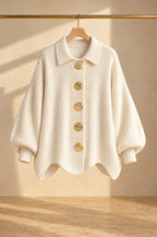 Gaeta cardigan, cream, on a rail