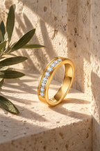 Recco moissanite band, gold, in a travertine niche