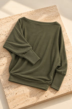 Scilla batwing top, olive, on travertine