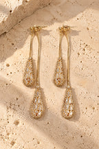 Fornillo drop earrings, gold, on travertine
