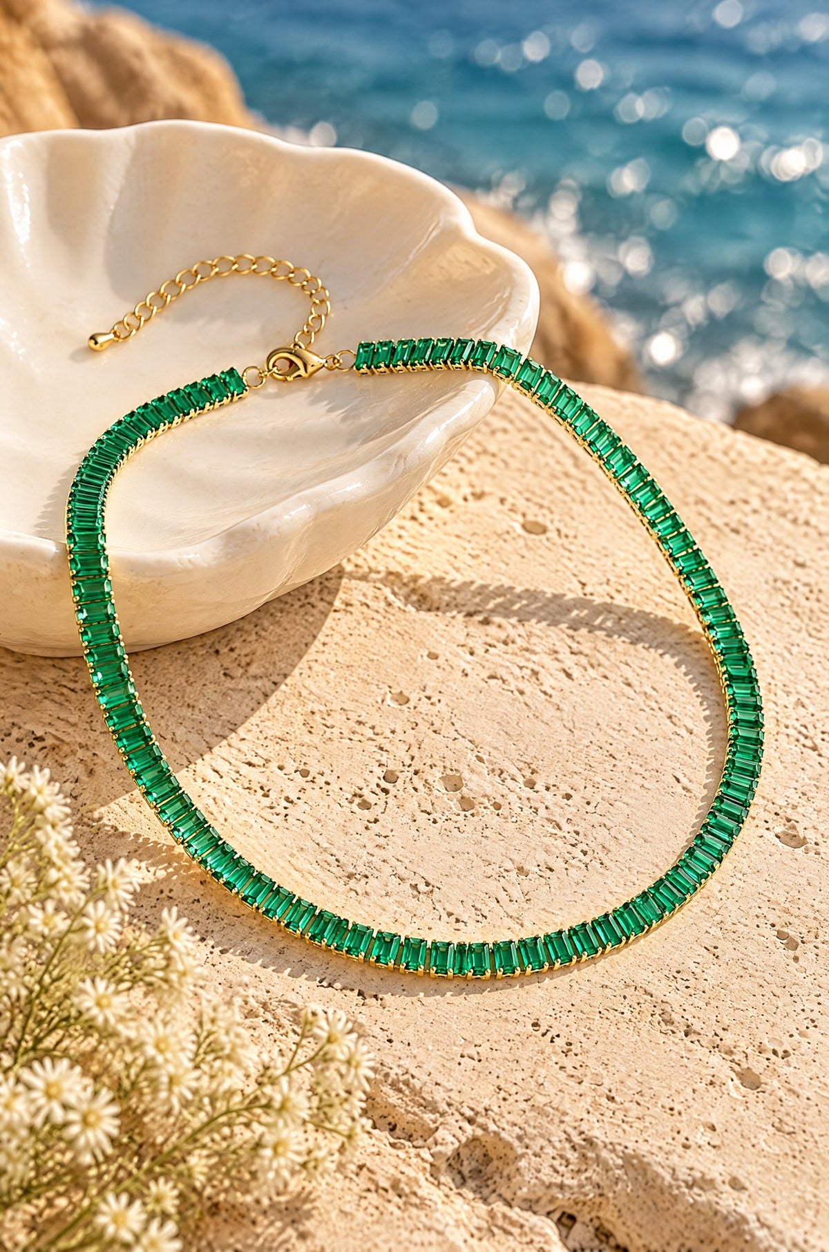 Smeraldo tennis necklace, on a stone ledge