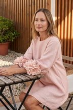 Petalo puff sleeve dress in pink, seated