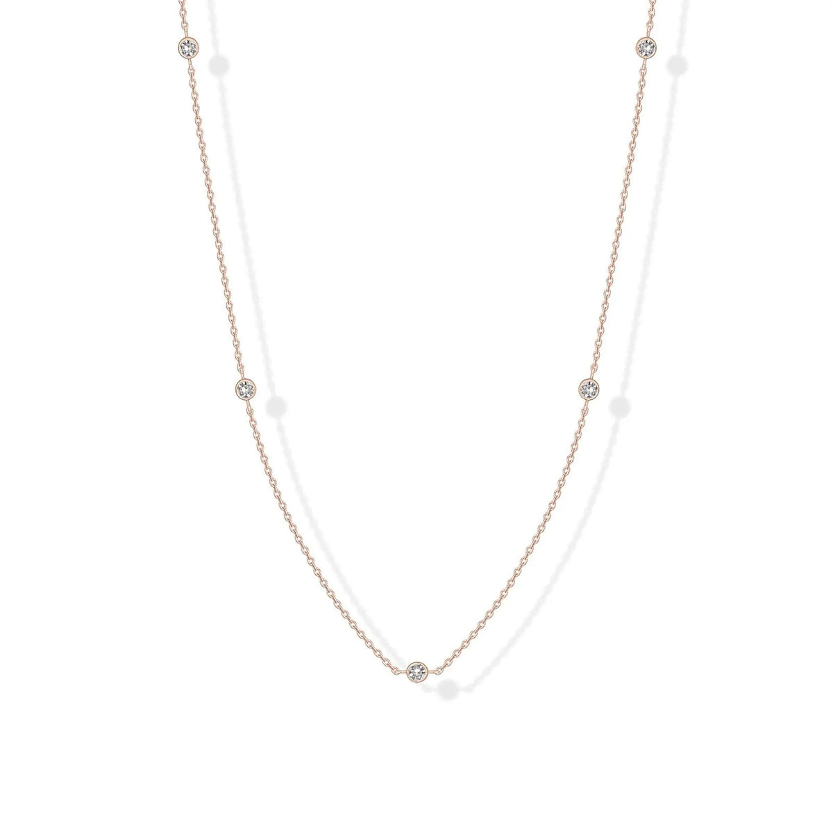 Stellina station necklace in rose gold, full length on white