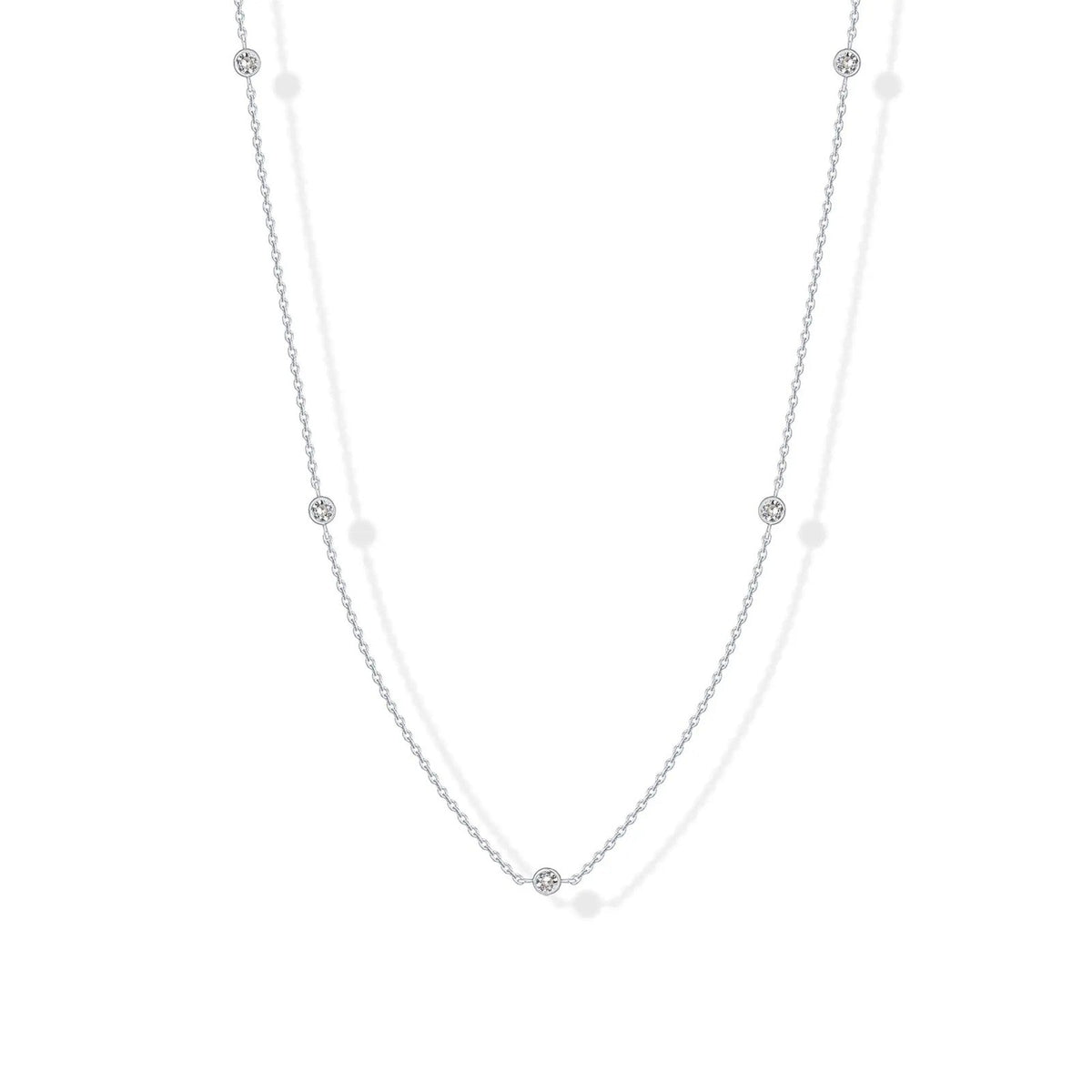 Stellina station necklace in white gold, full length on white