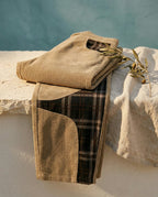 Vietri barrel pant folded on a limestone ledge