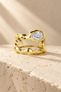 Vulcano ring cover in gold on travertine