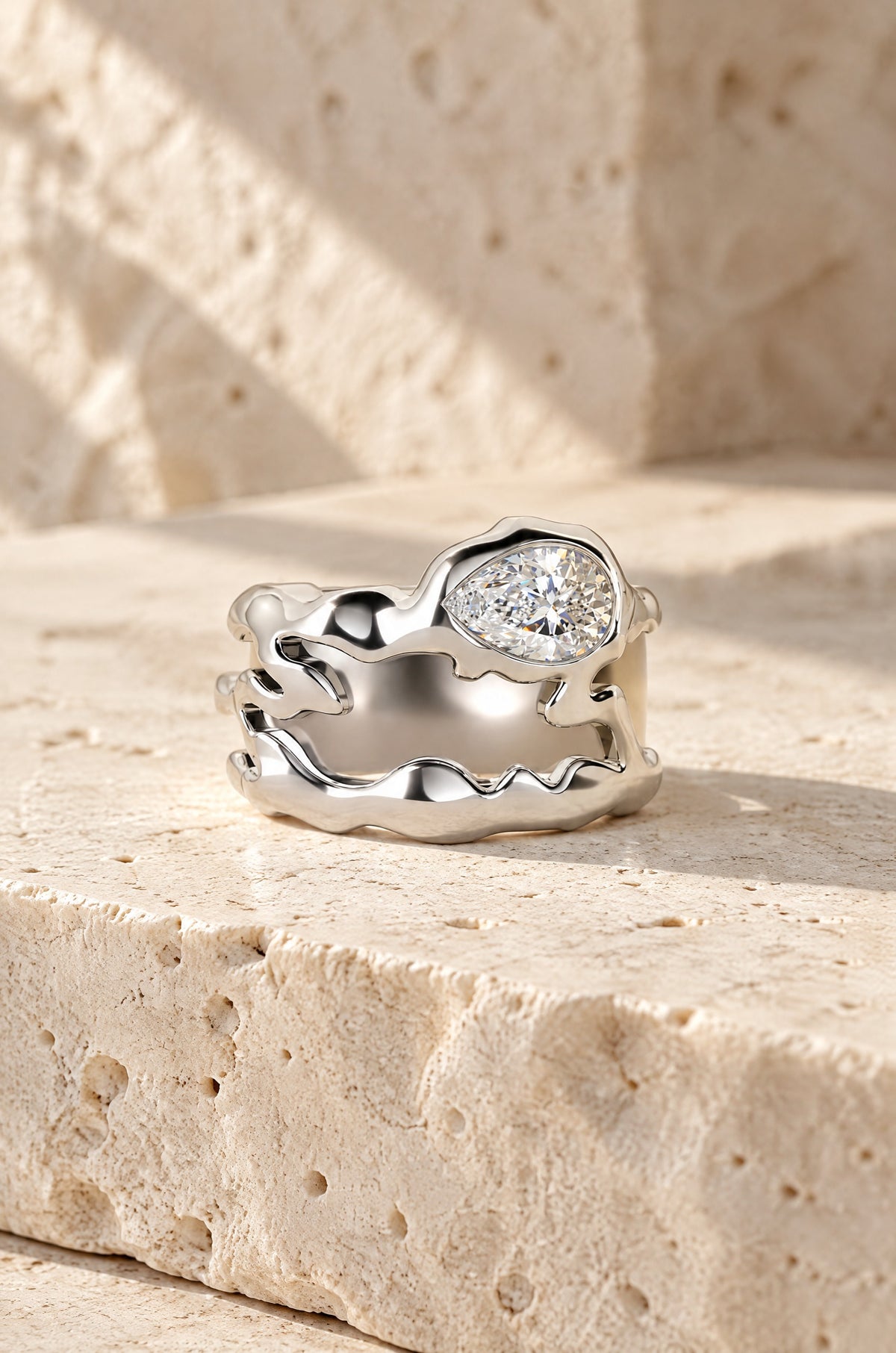 Vulcano ring cover in silver on travertine